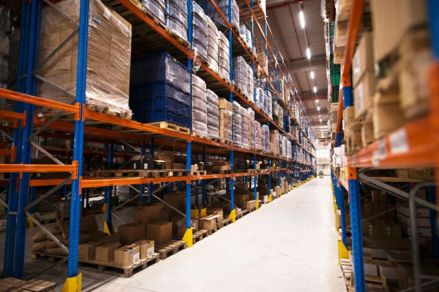 https://sevenhillscpa.com/wp-content/uploads/2023/07/interior-large-distribution-warehouse-with-shelves-stacked-with-palettes-goods-ready-market_342744-1481-640x427.jpg